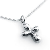 Tiny polished silver cross pendant on a delicate chain